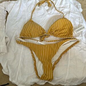 Brand new vitamin A yellow striped bikini size medium/8. Never worn!